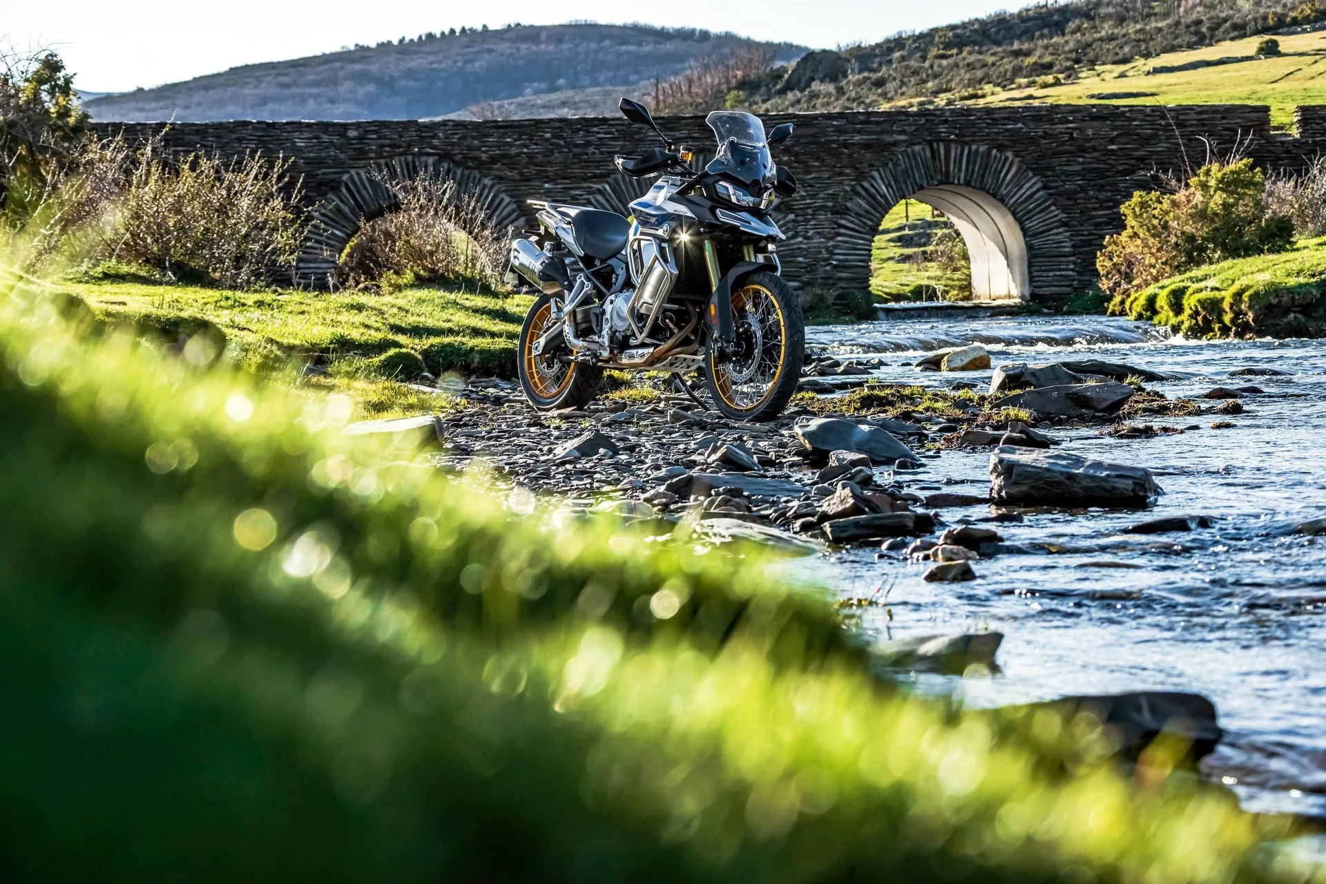 a person riding a motorcycle on a dirt road